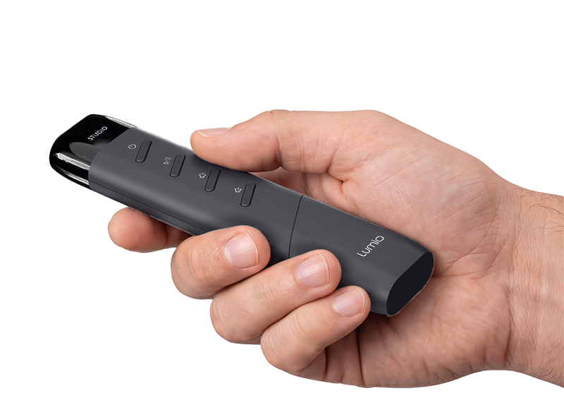 A hand holding the Minion OLED remote